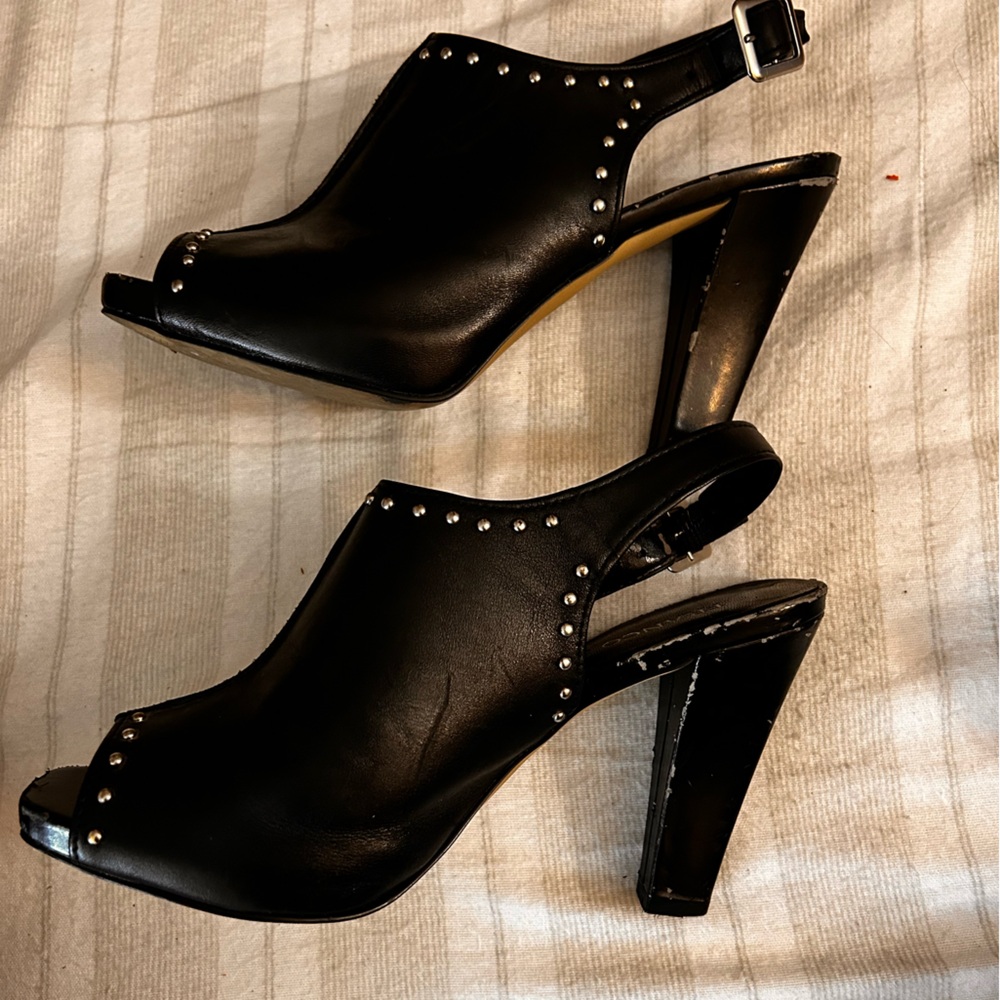 Black leather sling back shoes with a chunky heel